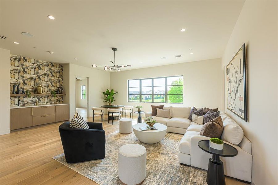 Upstairs living sink and fridge in bar area