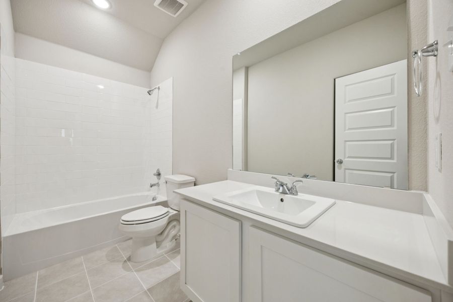 Bathroom in the Oscar home plan by Trophy Signature Homes – REPRESENTATIVE PHOTO
