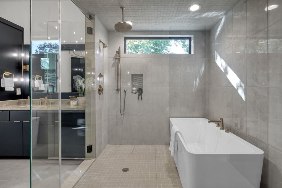 Additional bath featuring walk-in shower and modern tile finishes. Additional bath featuring walk-in shower and modern tile finishes.