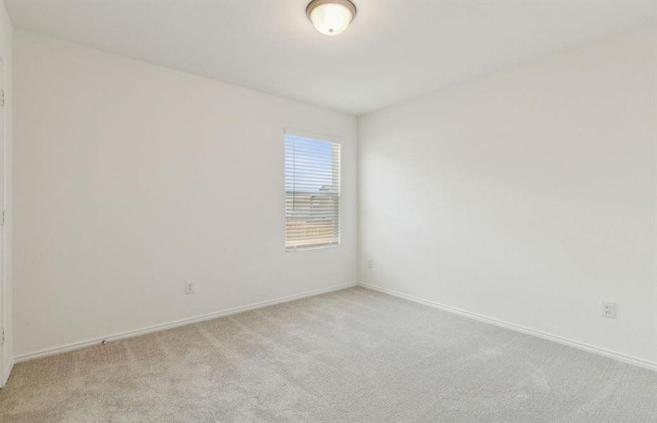 Spacious secondary bedroom with ample closet space *real home pictured