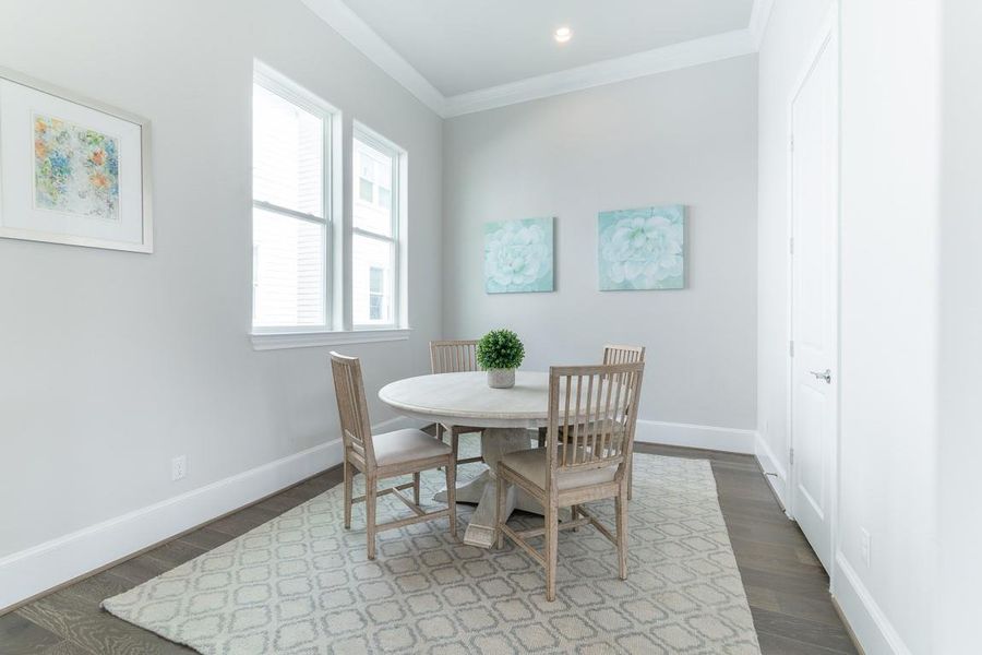 Dining is special in this "L" shaped open area.  Similar plan and finishes.