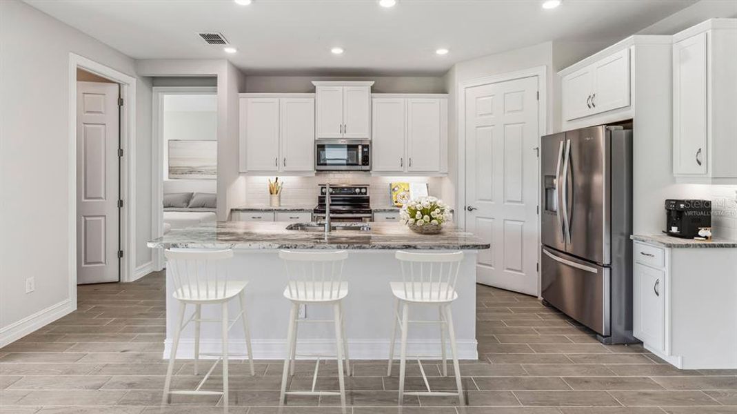 Furnished interior view inside a new home in Coral Lakes - Tradition & Express, Punta Gorda (Image 11).