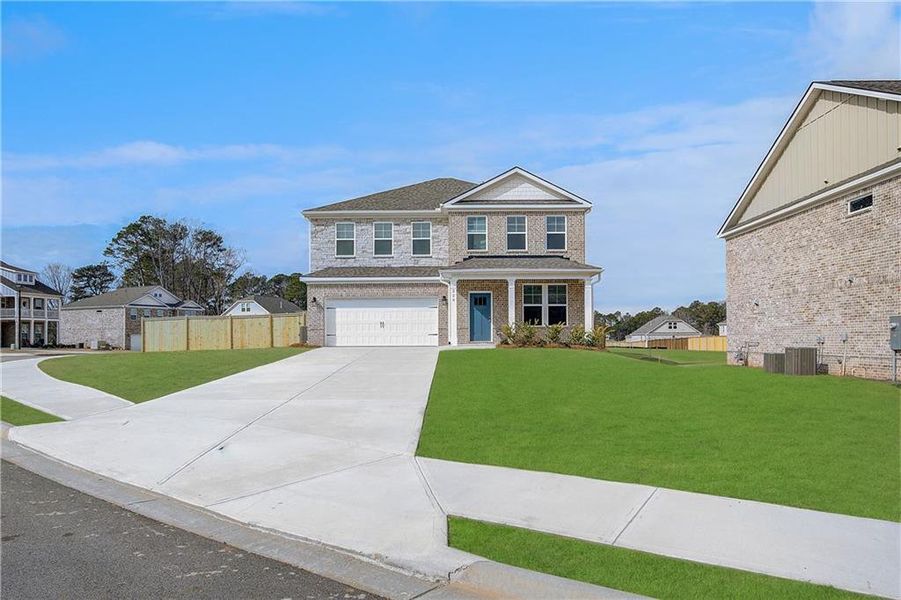 Front exterior of a new home in Burchwood, Stockbridge, GA, highlighting curb appeal (Image 23).