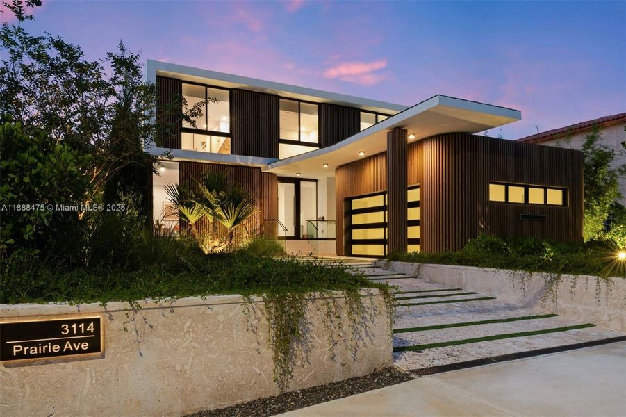 Front exterior of a new home in , Miami Beach, FL, highlighting curb appeal (Image 1). Front exterior of a new home in , Miami Beach, FL, highlighting curb appeal (Image 1).