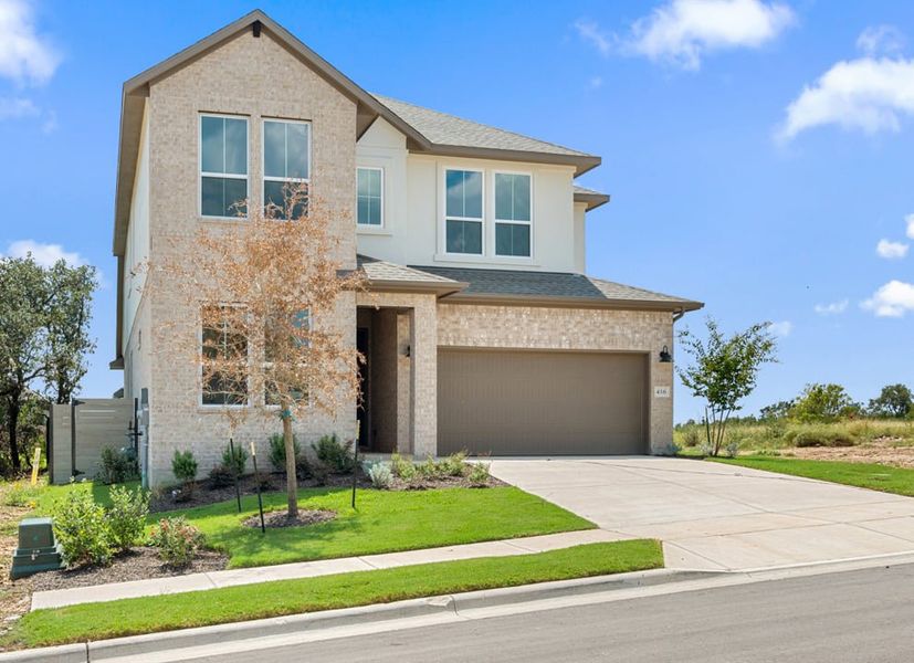 Front exterior of a new home in Arbor Collection At Wolf Ranch, Georgetown, TX, highlighting curb appeal (Image 2).