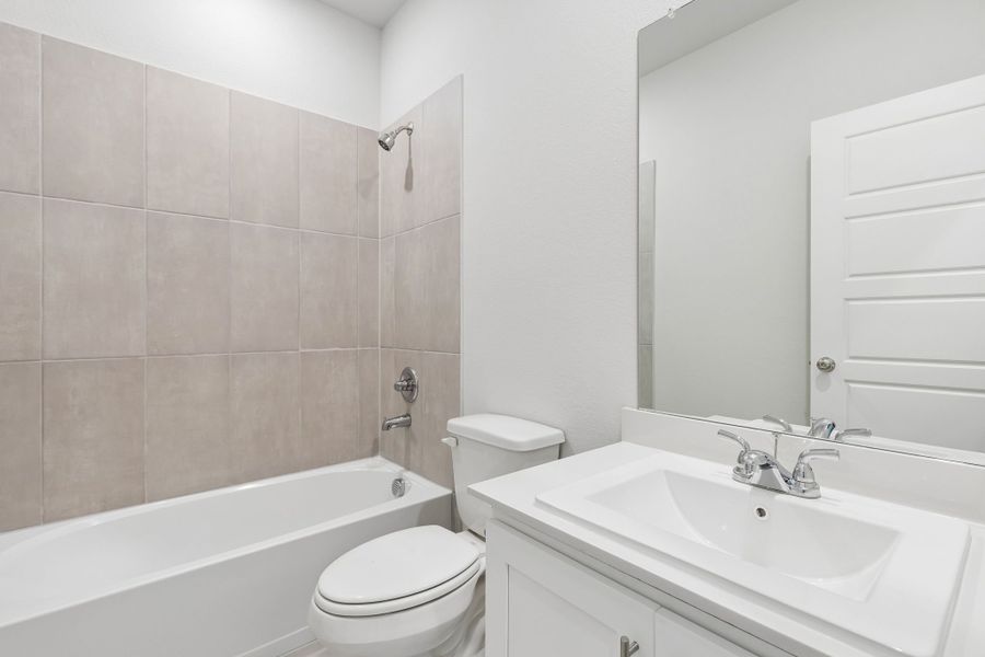 Bathroom in the Cypress home plan by Trophy Signature Homes - REPRESENTATIVE PHOTO
