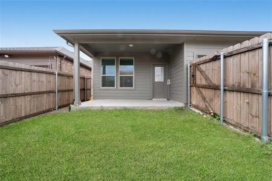 Exterior details and patio area of a home in Heritage Village, Haltom City (Image 3).