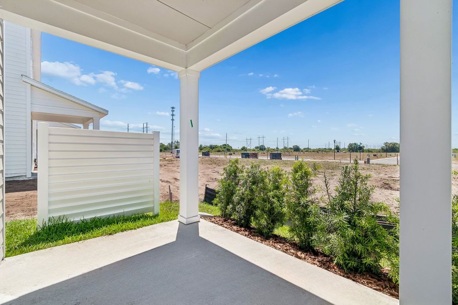 Representative exterior details of a home built from the The Peppermill by David Weekley Homes in Waterset Townhomes, Apollo Beach (Image 3).