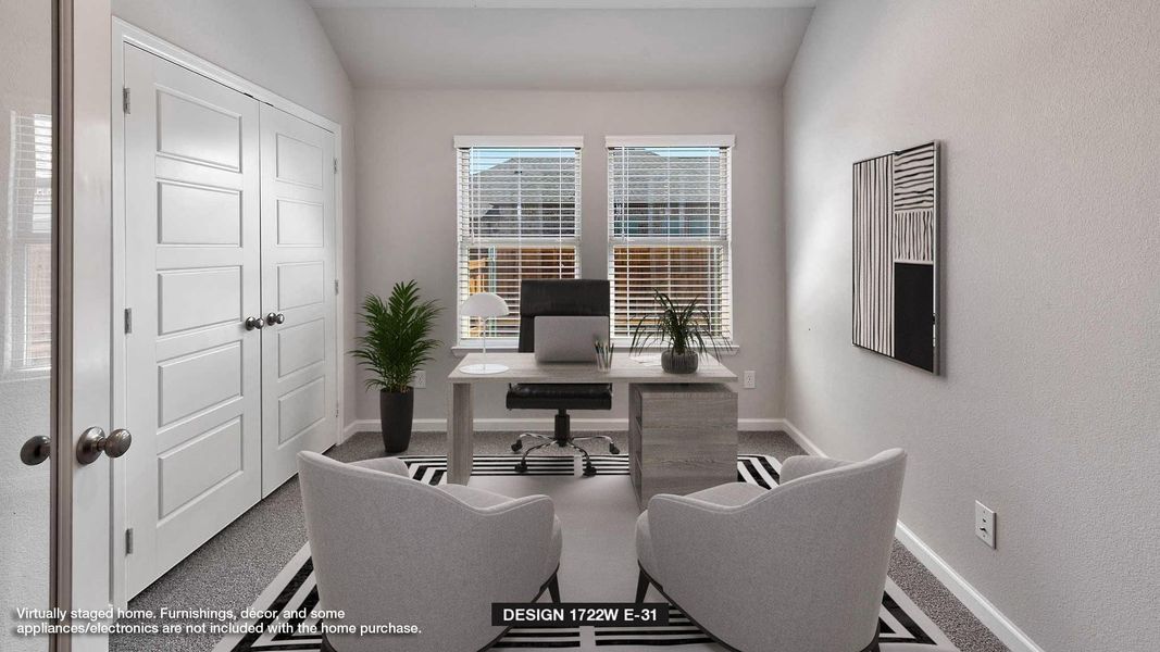 Home office with carpet and vaulted ceiling