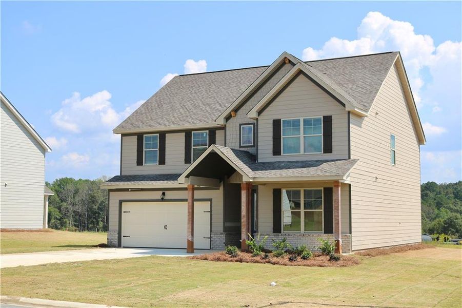 Front exterior of a new home in , Bonaire, GA, highlighting curb appeal (Image 2). Front exterior of a new home in , Bonaire, GA, highlighting curb appeal (Image 2).