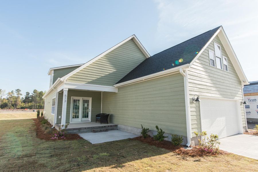 Representative exterior photo of a completed home built from the McKinley by Bill Clark Homes in The Sanctuary at Sunset Beach, Sunset Beach, NC (Image 31). Representative exterior photo of a completed home built from the McKinley by Bill Clark Homes in The Sanctuary at Sunset Beach, Sunset Beach, NC (Image 31).
