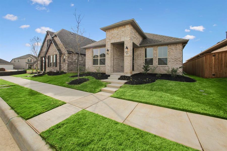 Front exterior of a new home in Tarrytown, Crowley, TX, highlighting curb appeal (Image 16).