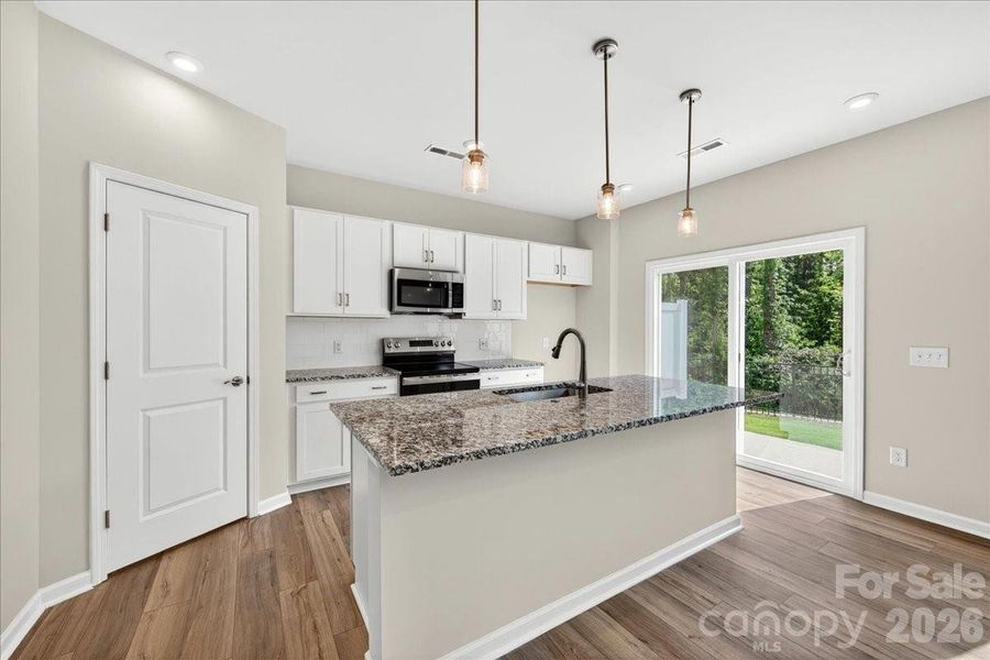 Light filled kitchen with access to the private outdoor living Light filled kitchen with access to the private outdoor living