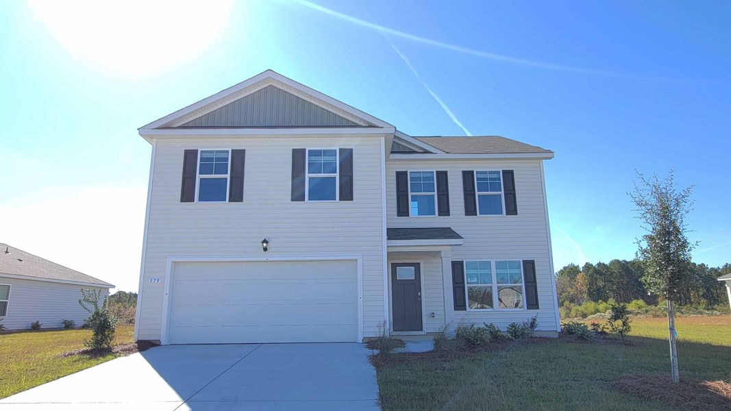 Front exterior of a new home in Jordanville Farms, Galivants Ferry, SC, highlighting curb appeal (Image 1).