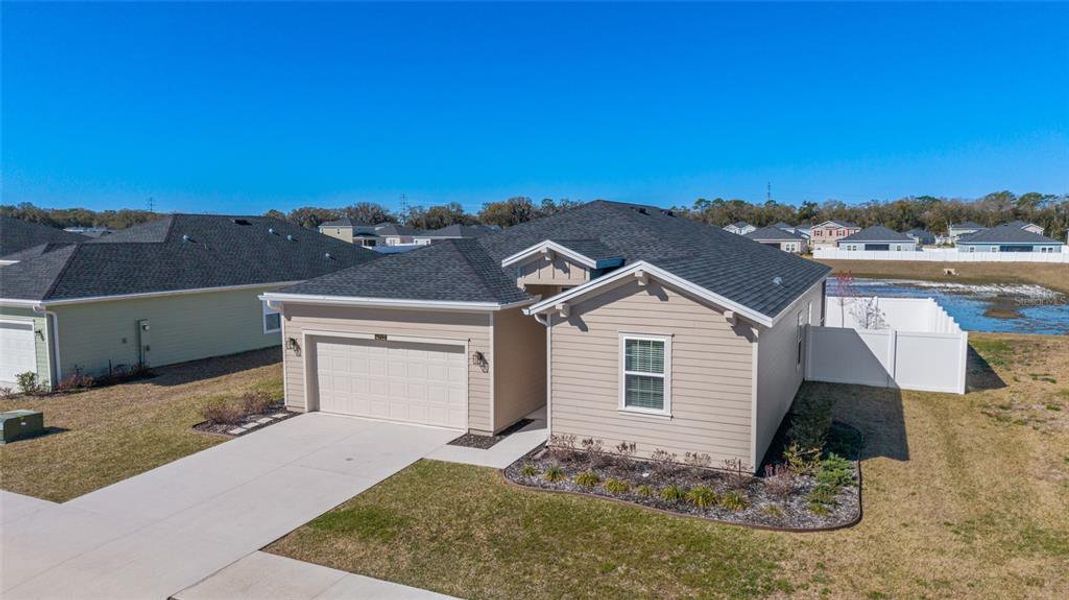 Front exterior of a new home in Millwood, Ocala, FL, highlighting curb appeal (Image 29).