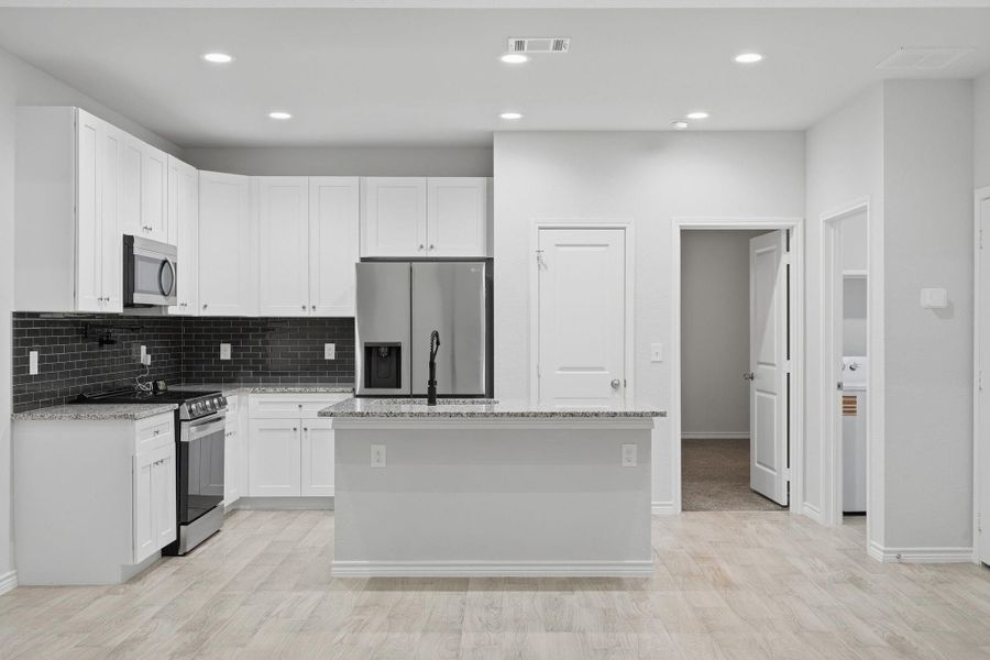 Furnished interior view inside a new home in Arrowhead Lakes, Willis (Image 5).