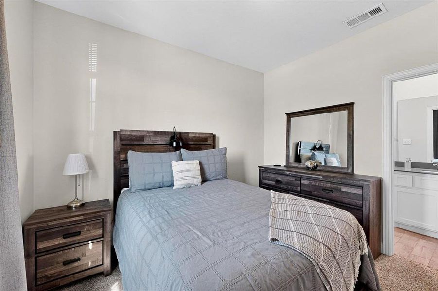 Bedroom featuring connected bathroom Bedroom featuring connected bathroom