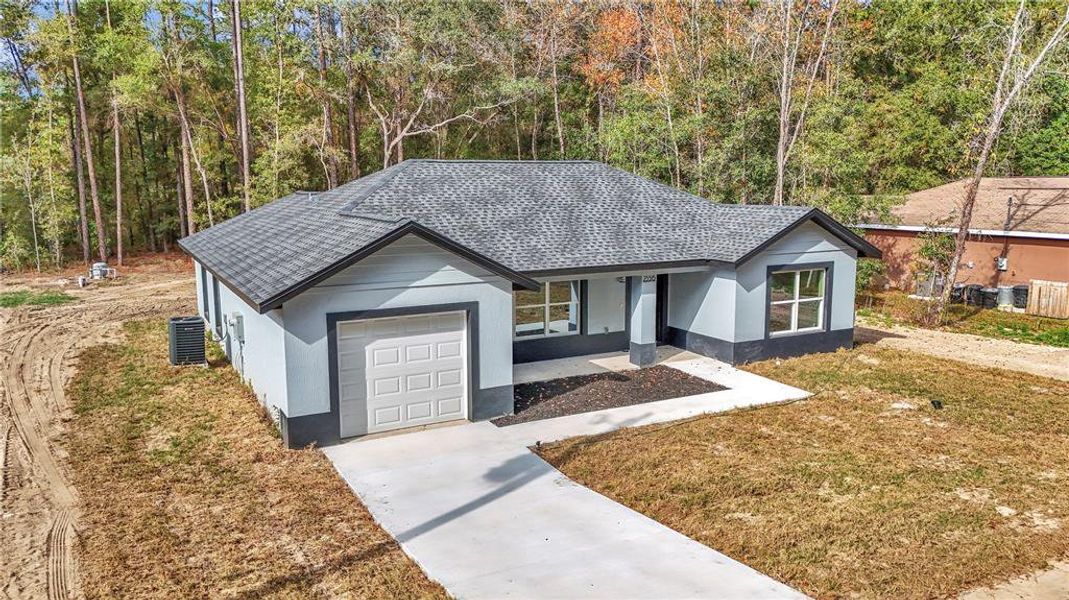 Front exterior of a new home in , Ocala, FL, highlighting curb appeal (Image 16).