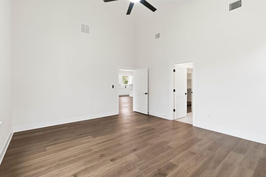 Warm wood-look flooring and soaring ceilings characterize this spacious, sun-drenched interior. Warm wood-look flooring and soaring ceilings characterize this spacious, sun-drenched interior.