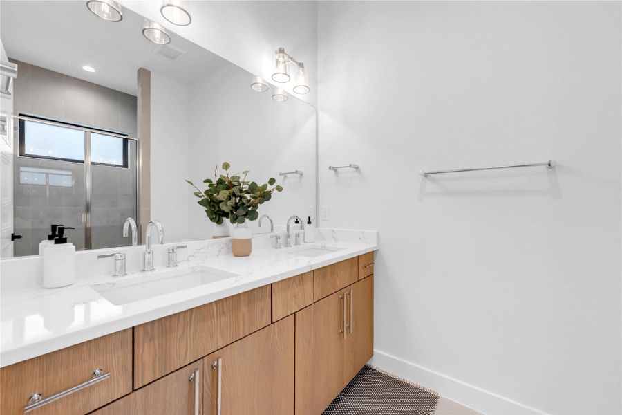 Bathroom five: Clean lines and a spacious double vanity elevate this contemporary bathroom space.