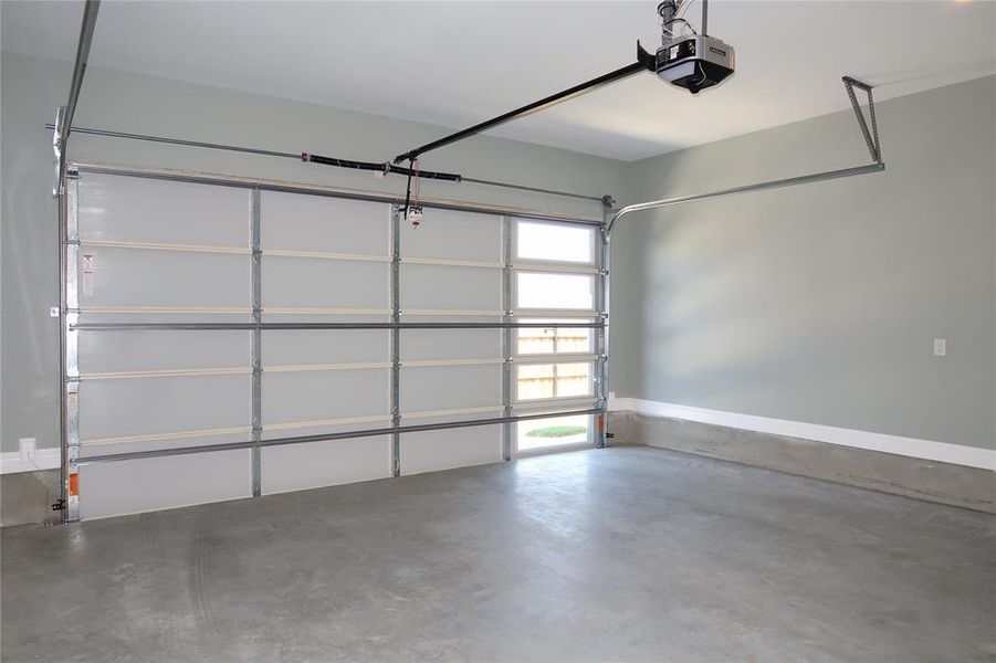 Garage featuring a garage door opener