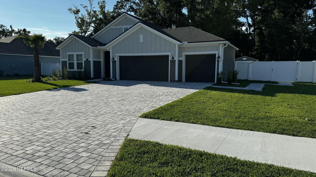 Front exterior of a new home in McGirt's Creek, Yulee, FL, highlighting curb appeal (Image 11).