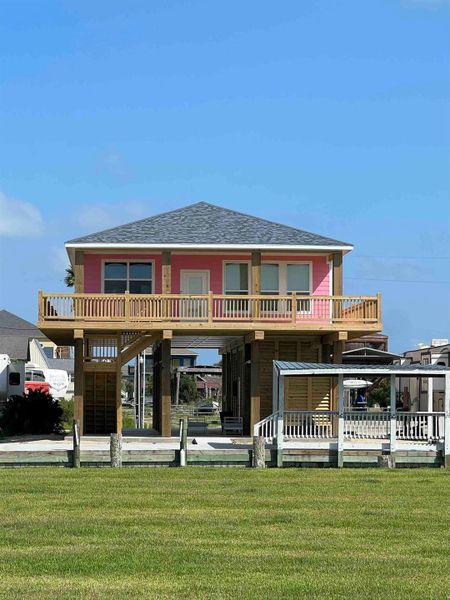 Front exterior of a new home in , Bolivar Peninsula, TX, highlighting curb appeal (Image 1).
