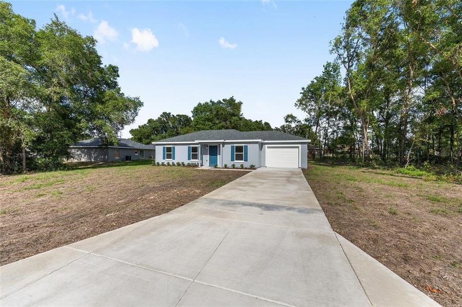 Front exterior of a new home in , Ocala, FL, highlighting curb appeal (Image 2).
