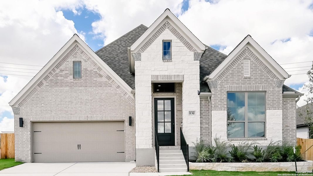 Front exterior of a new home in Cibolo Valley Heights 65', Cibolo, TX, highlighting curb appeal (Image 1).