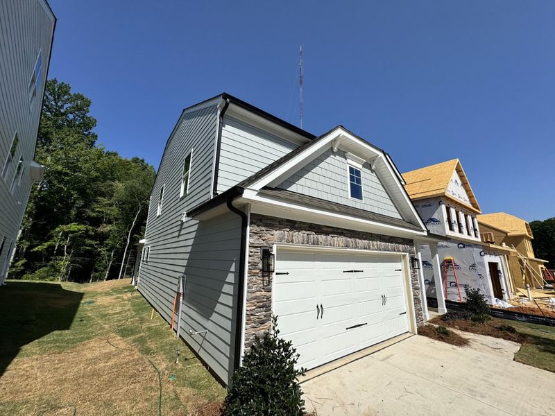 Front exterior of a new home in Caldwell Forest, Charlotte, NC, highlighting curb appeal (Image 7). Front exterior of a new home in Caldwell Forest, Charlotte, NC, highlighting curb appeal (Image 7).