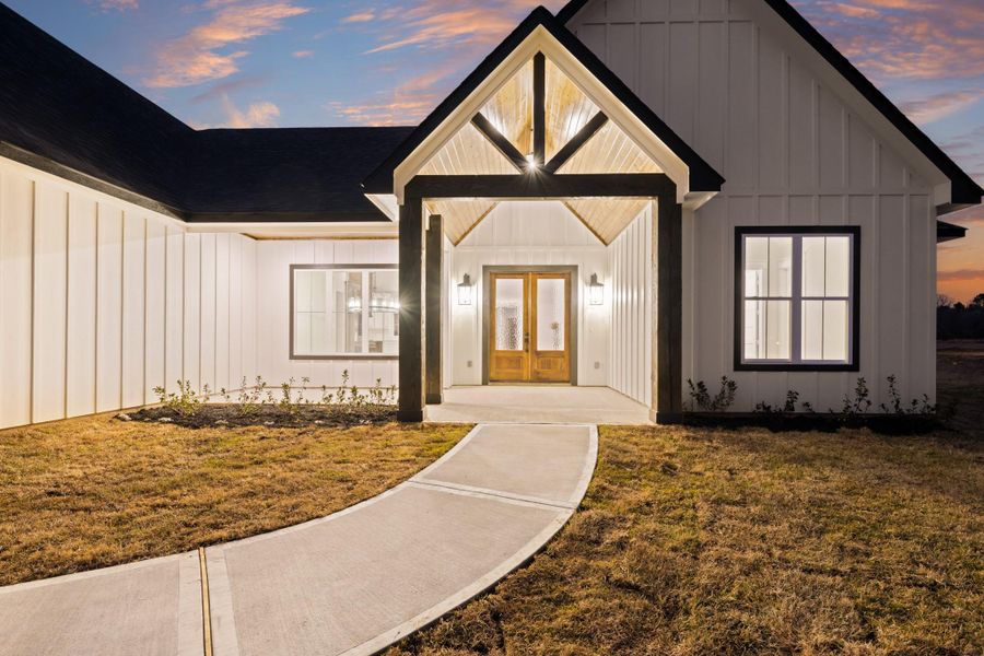 Front exterior of a new home in , New Waverly, TX, highlighting curb appeal (Image 26). Front exterior of a new home in , New Waverly, TX, highlighting curb appeal (Image 26).