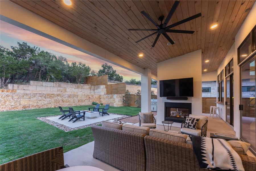 Covered outdoor living space featuring a wood-finish vaulted ceiling with recessed lighting and a ceiling fan Covered outdoor living space featuring a wood-finish vaulted ceiling with recessed lighting and a ceiling fan