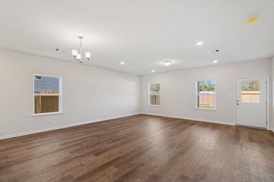 The Crawford- Dining Area and Family Room. Home under construction, photo used for illustrative purposes only, colors and options will vary.