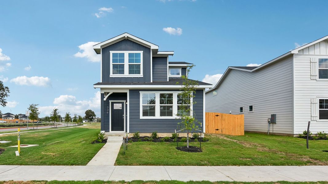 Front exterior of a new home in Valverde, Bastrop, TX, highlighting curb appeal (Image 2). Front exterior of a new home in Valverde, Bastrop, TX, highlighting curb appeal (Image 2).
