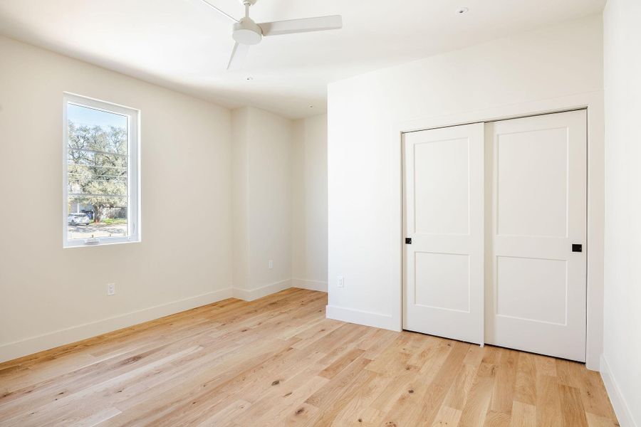 Secondary bedroom is large and features a useful desk/dresser nook.