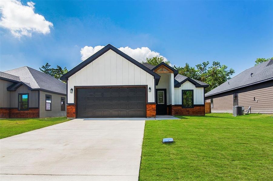 Front exterior of a new home in , Whitewright, TX, highlighting curb appeal (Image 16). Front exterior of a new home in , Whitewright, TX, highlighting curb appeal (Image 16).
