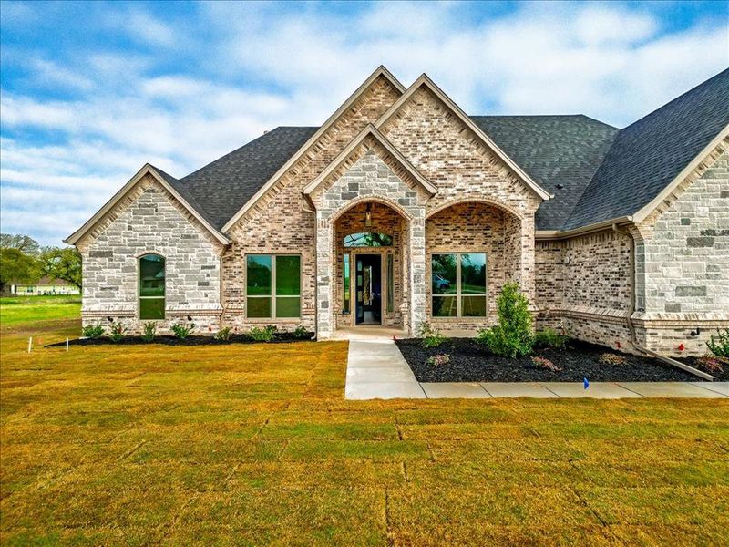 Front exterior of a new home in , Granbury, TX, highlighting curb appeal (Image 25). Front exterior of a new home in , Granbury, TX, highlighting curb appeal (Image 25).