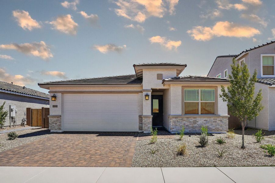 Front exterior of a new home in Artisan at Asante, Surprise, AZ, highlighting curb appeal (Image 20).