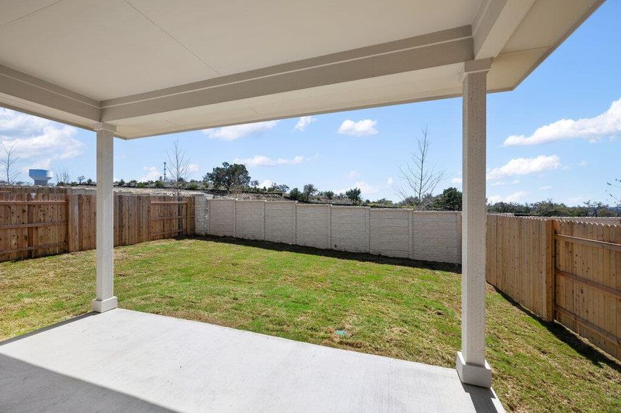 Exterior details and patio area of a home in Cannon Ranch, Dripping Springs (Image 28).