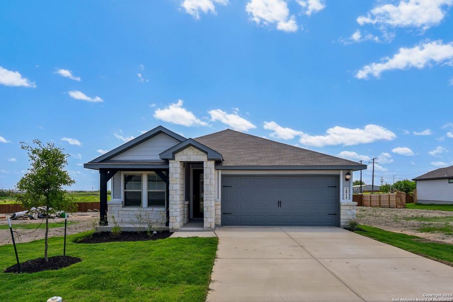 Front exterior of a new home in Catalina, Converse, TX, highlighting curb appeal (Image 1).