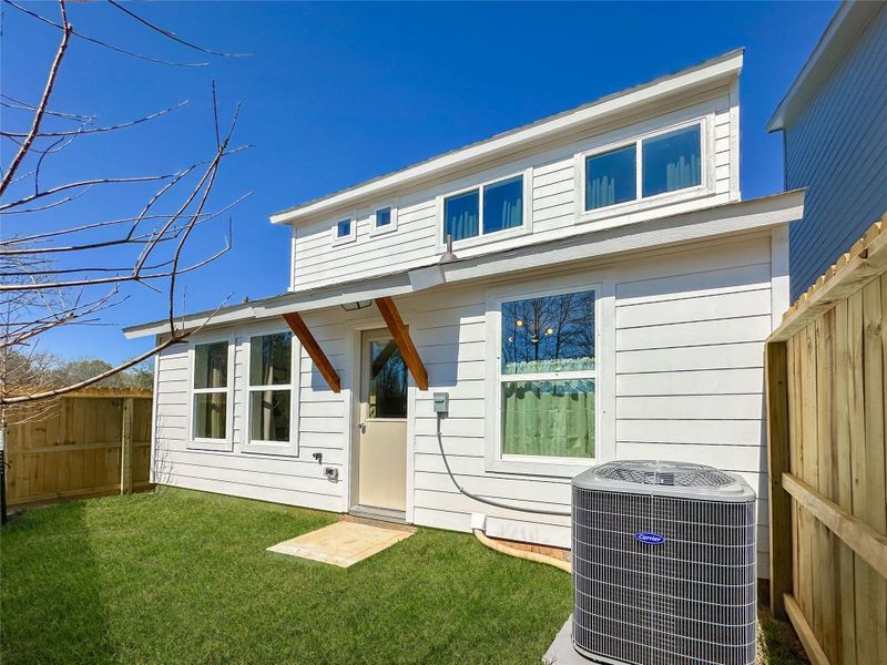 Exterior details and patio area of a home in , Conroe (Image 26).