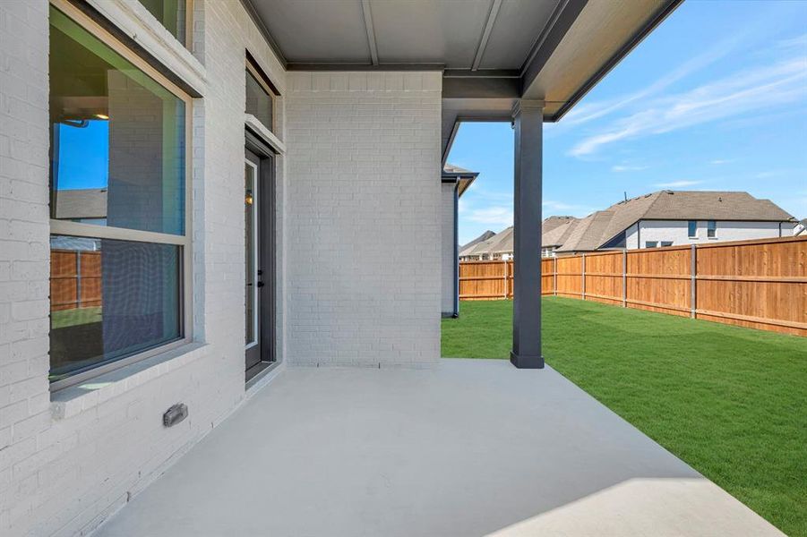 Exterior details and patio area of a home in Sandbrock Ranch, Aubrey (Image 2). Exterior details and patio area of a home in Sandbrock Ranch, Aubrey (Image 2).