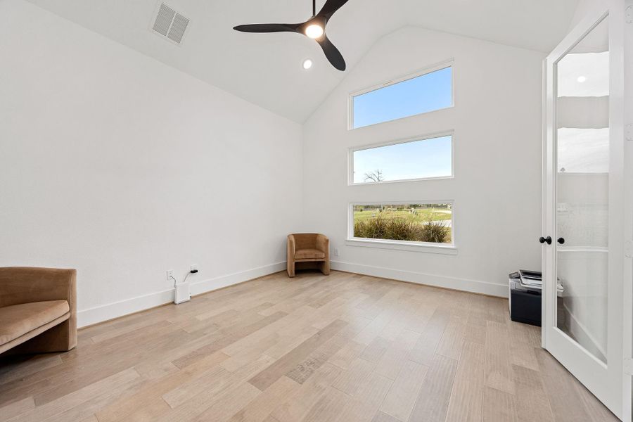 Quietly nestled in front of the home is the beautifully designed home office with double doors.