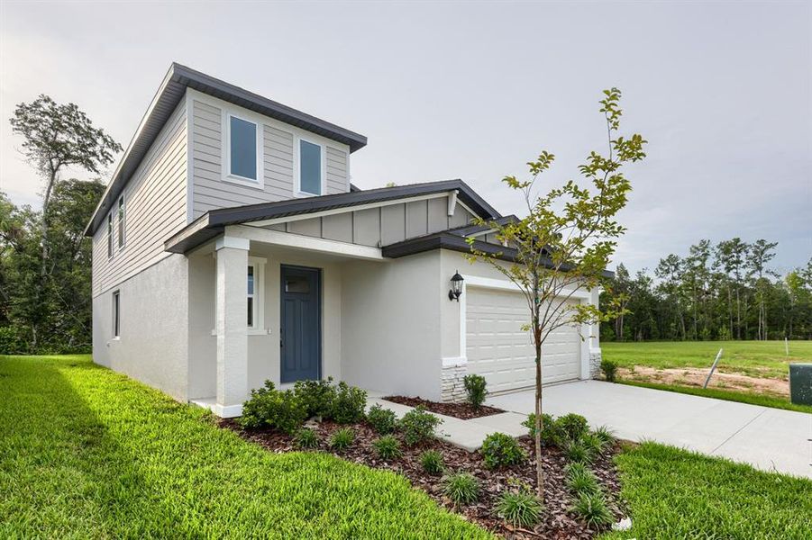 Front exterior of a new home in Leyland Preserve - Premier Series, Brooksville, FL, highlighting curb appeal (Image 2). Front exterior of a new home in Leyland Preserve - Premier Series, Brooksville, FL, highlighting curb appeal (Image 2).
