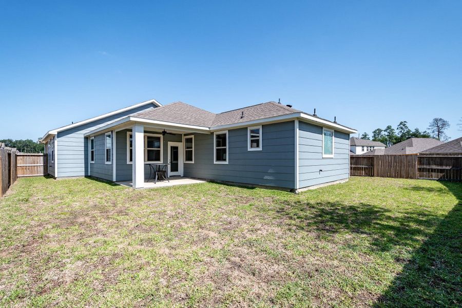 Deep backyard with plenty of room for play, pets, or future landscaping.