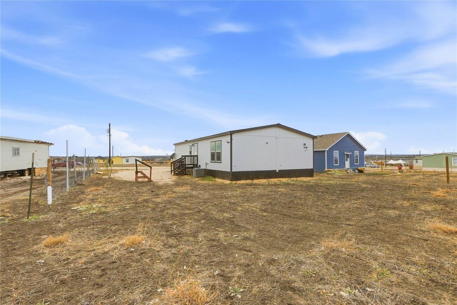 A spacious lot provides ample room for outdoor living and potential expansion, creating a blank canvas for your dream property.