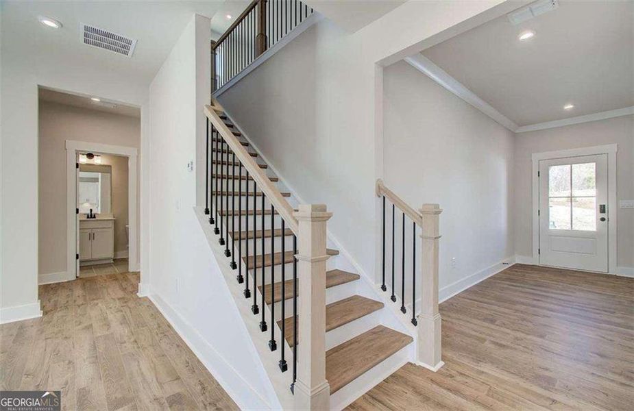 Spacious, unfurnished interior of a new home in The Paddocks at Doc Hughes, Buford (Image 44).