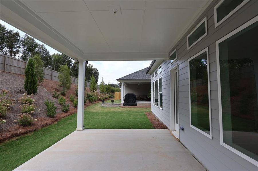 Exterior details and patio area of a home in Maple Grove at Towne Lake, Woodstock (Image 3).