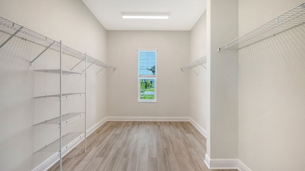 Spacious, unfurnished interior of a new home in Canoe Creek Real Estate and Homes for Sale in Parrish, FL - Neal Communities, Parrish (Image 49).