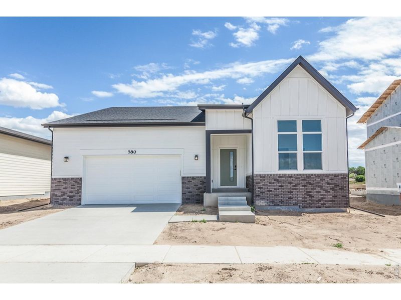 Front exterior of a new home in Prairie Song Story Collection - Single Family Homes, Windsor, CO, highlighting curb appeal (Image 27).